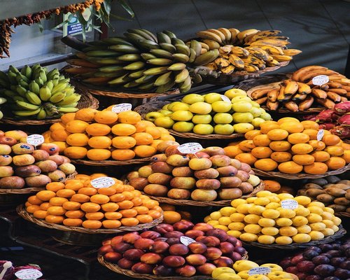A colorful selection of organic vegetables and tropical fruits from a local Costa Rican farm market